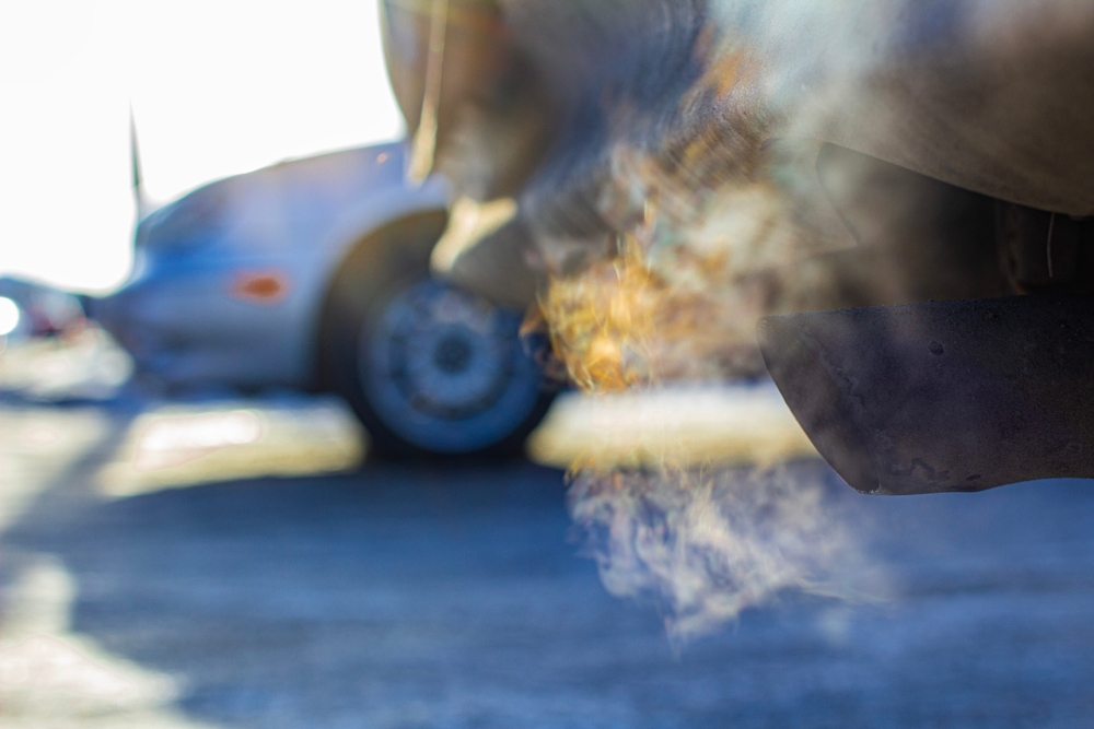 An idling car polluting the air.